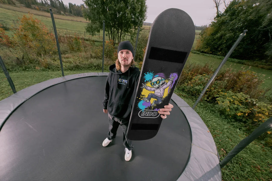 Rider standing on a trampoline with the INDO Skate