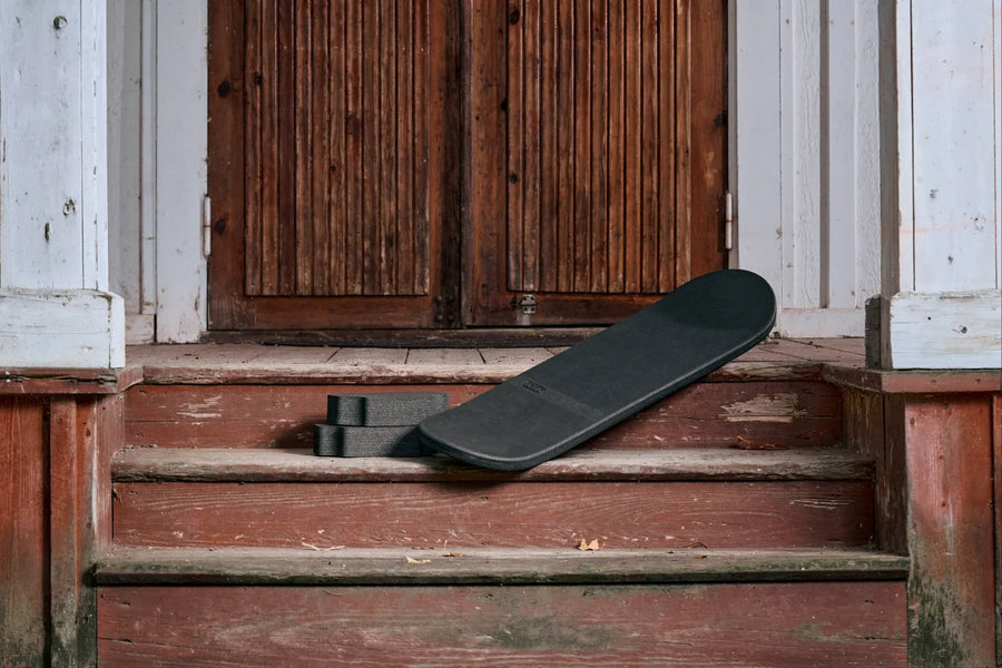 INDO Skate leaning on wooden steps